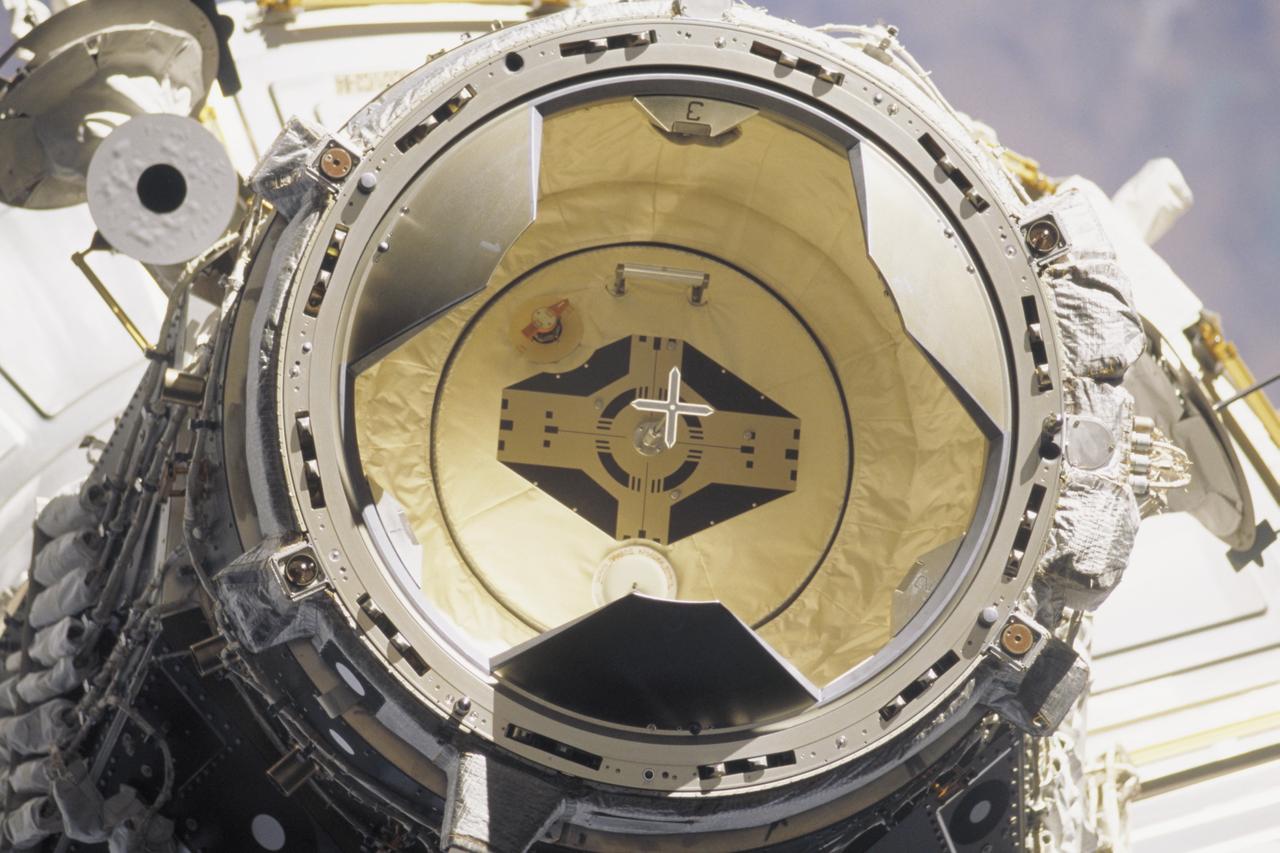 STS106-346-008 (17 Sept. 2000) --- This close-up external view of the Androgynous Peripheral Attachment System (APAS) of Pressurized Mating Adapter 2 (PMA2) was taken from the space shuttle Atlantis during undocking with the International Space Station. Visible are the APAS petals, hatch and target, as well as the forward endcone of Unity node on the ISS. The undocking took place on Sept. 17, 2000 at 10:46 p.m. (CDT).