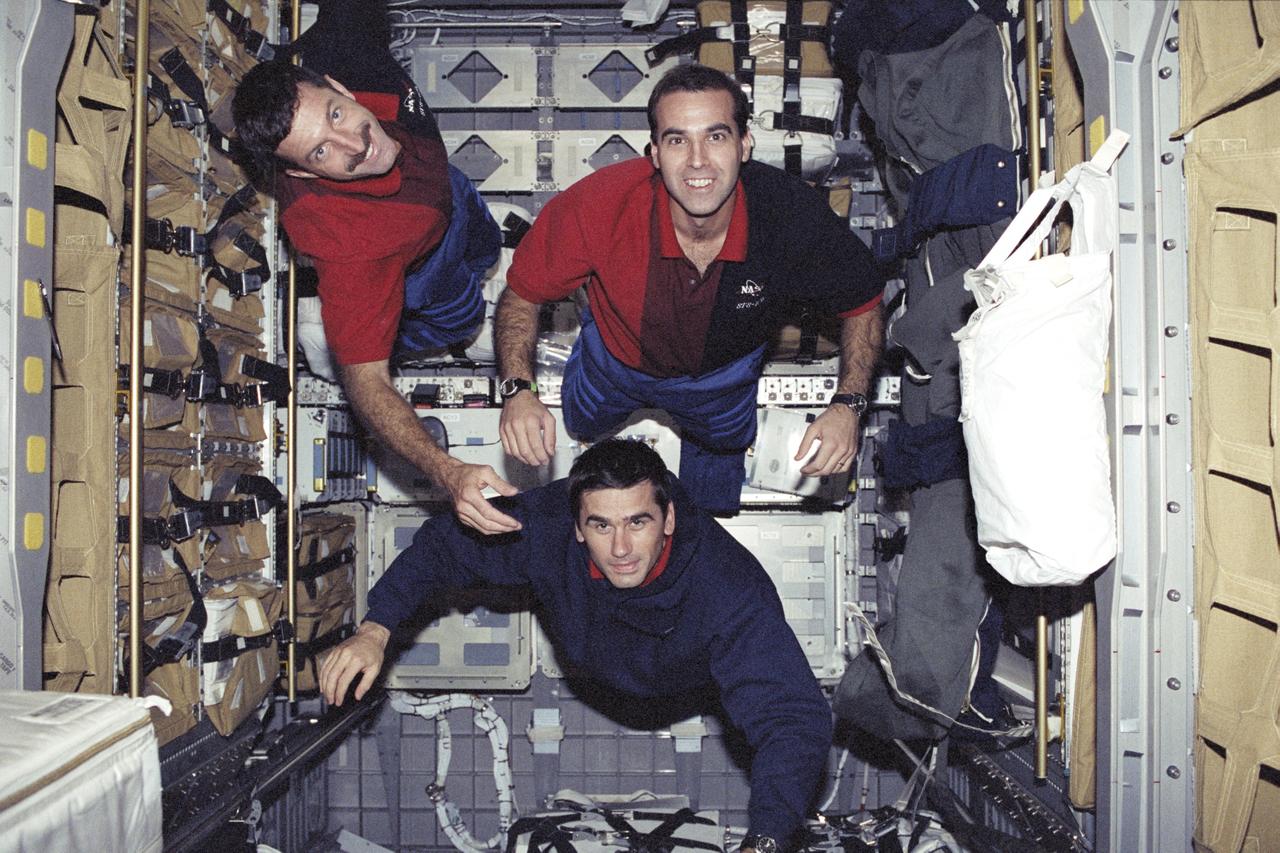 STS106-369-019 (8-20 September 2000) ---  Two astronauts and a cosmonaut, all mission specialists, float onboard Spacehab.  They are astronauts Daniel C. Burbank (top left) and Richard A. Mastracchio (top right), along with cosmonaut Yuri I. Malenchenko. The Spacehab double module is as &quot;empty&quot; as it was at any other time during the STS-106 mission in this scene, photographed during mission's end.  The seven-man crew had moved a large amount of supplies and hardware to the International Space Station (ISS).