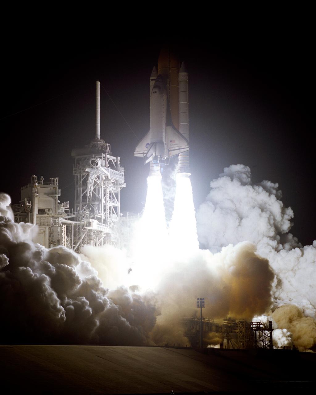 STS109-S-007 (1 March 2002) --- The  Space Shuttle Columbia begins its 27th flight in the pre-dawn hours from Launch Pad 39A.  Liftoff for STS-109 occurred at 6:22:02:08 a.m., EST (11:22:02:08 GMT). The goal of the mission is the maintenance and upgrade of the Hubble Space Telescope, to be carried out in five space walks. On board the spacecraft were astronauts Scott D. Altman, Duane G. Carey, Nancy J. Currie, John M. Grunsfeld, James H. Newman, Richard M. Linnehan and Michael J. Massimino.