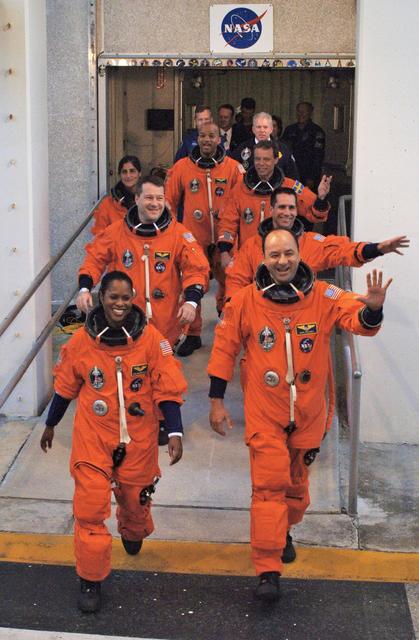 NASA image: STS-116 crew exits Operations and Checkout Building