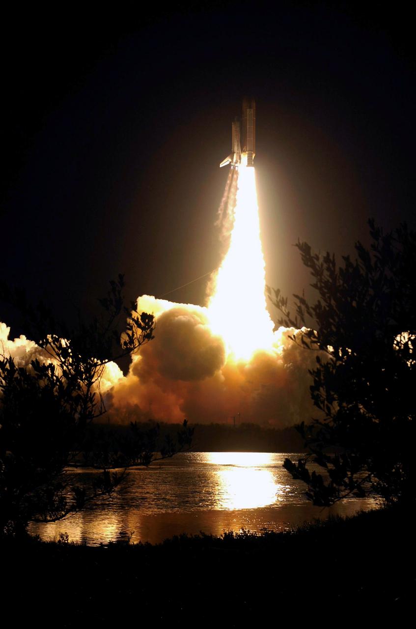 STS116-S-018 (9 Dec. 2006) --- Against a black night sky, the Space Shuttle Discovery and its seven-member crew head toward Earth-orbit and a scheduled link-up with the International Space Station. Liftoff from the Kennedy Space Center's launch pad 39B occurred at 8:47 p.m. (EST) on Dec. 9, 2006 in what was the first evening shuttle launch since 2002. The STS-116 crew will link up with the station on Monday, Dec. 11, to begin a complex, week-long stay that will rewire the outpost and increase its power supply. During three spacewalks and intricate choreography with ground controllers, the astronauts will bring electrical power on line generated by a giant solar array wing delivered to the station in September.