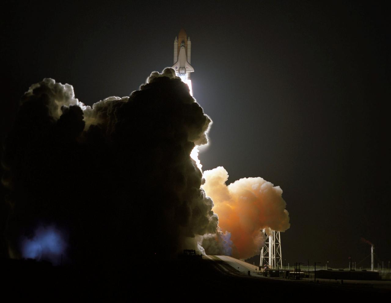 STS116-S-021 (9 Dec. 2006) --- Against a black night sky, the Space Shuttle Discovery and its seven-member crew head toward Earth-orbit and a scheduled link-up with the International Space Station. Liftoff from the Kennedy Space Center's launch pad 39B occurred at 8:47 p.m. (EST) on Dec. 9, 2006 in what was the first evening shuttle launch since 2002. The STS-116 crew will link up with the station on Monday, Dec. 11, to begin a complex, week-long stay that will rewire the outpost and increase its power supply. During three spacewalks and intricate choreography with ground controllers, the astronauts will bring electrical power on line generated by a giant solar array wing delivered to the station in September.