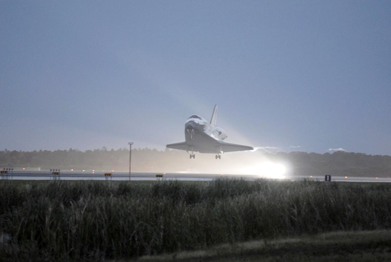 STS116-S-056 (22 Dec. 2006) --- Discovery approaches touchdown on Runway 15 at NASA Kennedy Space Center's Shuttle Landing Facility, concluding mission STS-116. Aboard are astronauts Mark L. Polansky, commander; William A. Oefelein, pilot; and Robert L. Curbeam Jr., Joan E. Higginbotham, Nicholas J.M. Patrick and European Space Agency astronauts Christer Fuglesang and Thomas Reiter--all mission specialists. Reiter is returning from a six-month stay on the International Space Station. During the mission, three spacewalks attached the P5 integrated truss structure to the station, and completed the rewiring of the orbiting laboratory's power system. A contingency spacewalk was added to retract a stubborn solar array. Main gear touchdown was at 5:32 p.m. (EST). Nose gear touchdown was at 5:32:12 p.m. and wheel stop was at 5:32:52 p.m. At touchdown -- nominally about 2,500 ft. beyond the runway threshold -- the orbiter is traveling at a speed ranging from 213 to 226 mph. Discovery traveled 5,330,000 miles, landing on orbit 204. Mission elapsed time was 12 days, 20 hours, 44 minutes and 16 seconds. This is the 64th landing at KSC.