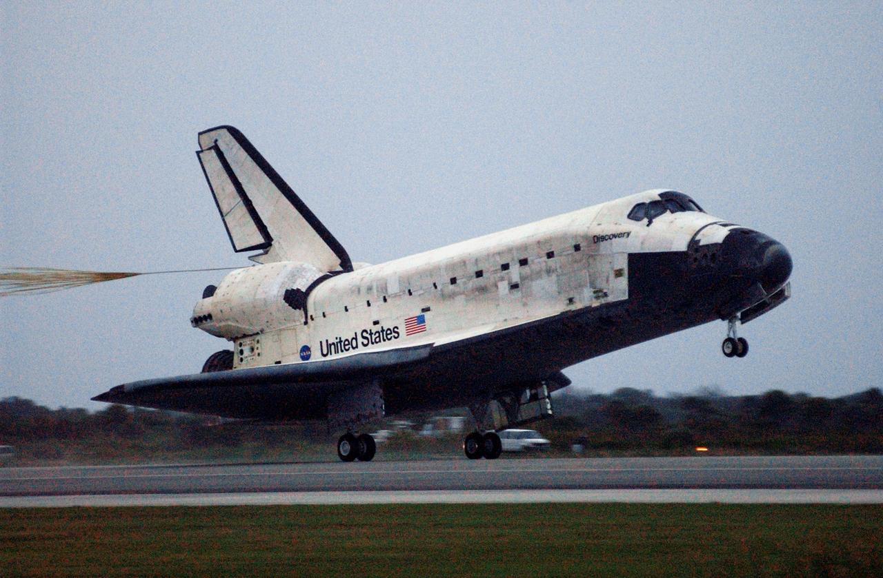STS116-S-065 (22 Dec. 2006) --- Discovery's main landing gear touches down on Runway 15 at NASA Kennedy Space Center's Shuttle Landing Facility, concluding mission STS-116. Aboard are astronauts Mark L. Polansky, commander; William A. Oefelein, pilot; and Robert L. Curbeam Jr., Joan E. Higginbotham, Nicholas J.M. Patrick and European Space Agency astronauts Christer Fuglesang and Thomas Reiter--all mission specialists. Reiter is returning from a six-month stay on the International Space Station. During the mission, three spacewalks attached the P5 integrated truss structure to the station, and completed the rewiring of the orbiting laboratory's power system. A contingency spacewalk was added to retract a stubborn solar array. Main gear touchdown was at 5:32 p.m. (EST). Nose gear touchdown was at 5:32:12 p.m. and wheel stop was at 5:32:52 p.m. At touchdown -- nominally about 2,500 ft. beyond the runway threshold -- the orbiter is traveling at a speed ranging from 213 to 226 mph. Discovery traveled 5,330,000 miles, landing on orbit 204. Mission elapsed time was 12 days, 20 hours, 44 minutes and 16 seconds. This is the 64th landing at KSC.