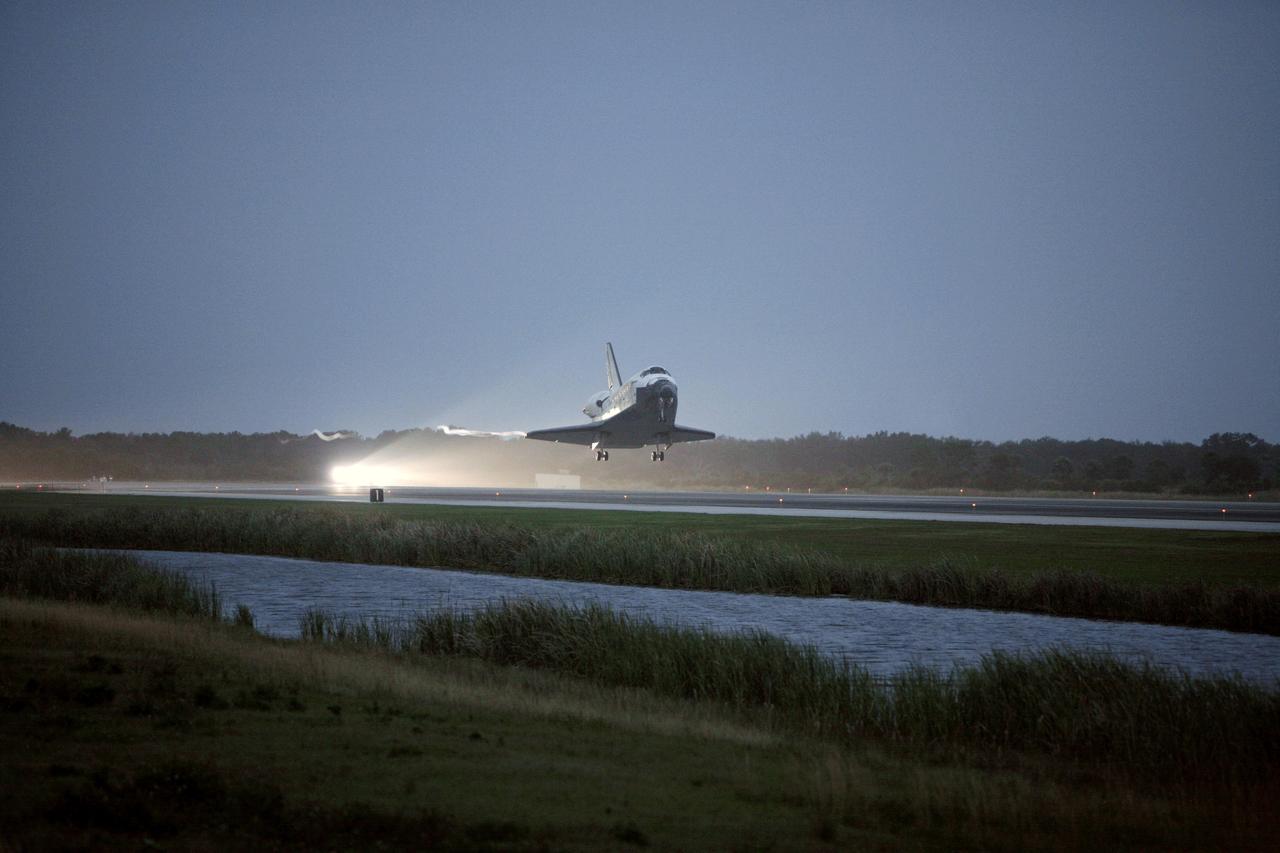 STS116-S-076 (22 Dec. 2006) --- Discovery approaches touchdown on Runway 15 at NASA Kennedy Space Center's Shuttle Landing Facility, concluding mission STS-116. Aboard are astronauts Mark L. Polansky, commander; William A. Oefelein, pilot; and Robert L. Curbeam Jr., Joan E. Higginbotham, Nicholas J.M. Patrick and European Space Agency astronauts Christer Fuglesang and Thomas Reiter--all mission specialists. Reiter is returning from a six-month stay on the International Space Station. During the mission, three spacewalks attached the P5 integrated truss structure to the station, and completed the rewiring of the orbiting laboratory's power system. A contingency spacewalk was added to retract a stubborn solar array. Main gear touchdown was at 5:32 p.m. (EST). Nose gear touchdown was at 5:32:12 p.m. and wheel stop was at 5:32:52 p.m. At touchdown -- nominally about 2,500 ft. beyond the runway threshold -- the orbiter is traveling at a speed ranging from 213 to 226 mph. Discovery traveled 5,330,000 miles, landing on orbit 204. Mission elapsed time was 12 days, 20 hours, 44 minutes and 16 seconds. This is the 64th landing at KSC.