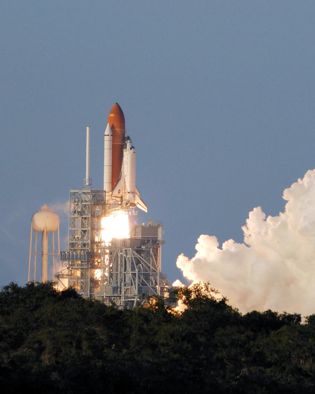 STS117-S-010 (8 June 2007) --- The Space Shuttle Atlantis and its seven-member STS-117 crew head toward Earth-orbit and a scheduled link-up with the International Space Station. Liftoff from Kennedy Space Center's launch pad 39A occurred at 7:38 p.m. (EDT) on June 8, 2007. Onboard are astronauts Rick Sturckow, commander; Lee Archambault, pilot; Jim Reilly, Patrick Forrester, John "Danny" Olivas, Steven Swanson and Clayton Anderson, all mission specialists. Anderson will join Expedition 15 in progress to serve as a flight engineer aboard the station. Atlantis will dock with the orbital outpost on Sunday, June 10, to begin a joint mission that will increase the complex's power generation capability. Using the shuttle and station robotic arms and conducting three scheduled spacewalks, the astronauts will install another set of giant solar array wings on the station and retract another array, preparing it for a future move.