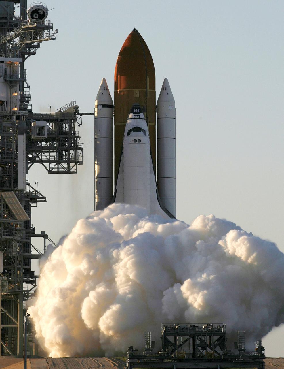 STS117-S-015 (8 June 2007) --- The Space Shuttle Atlantis and its seven-member STS-117 crew head toward Earth-orbit and a scheduled link-up with the International Space Station. Liftoff from Kennedy Space Center's launch pad 39A occurred at 7:38 p.m. (EDT) on June 8, 2007. Onboard are astronauts Rick Sturckow, commander; Lee Archambault, pilot; Jim Reilly, Patrick Forrester, John "Danny" Olivas, Steven Swanson and Clayton Anderson, all mission specialists. Anderson will join Expedition 15 in progress to serve as a flight engineer aboard the station. Atlantis will dock with the orbital outpost on Sunday, June 10, to begin a joint mission that will increase the complex's power generation capability. Using the shuttle and station robotic arms and conducting three scheduled spacewalks, the astronauts will install another set of giant solar array wings on the station and retract another array, preparing it for a future move.