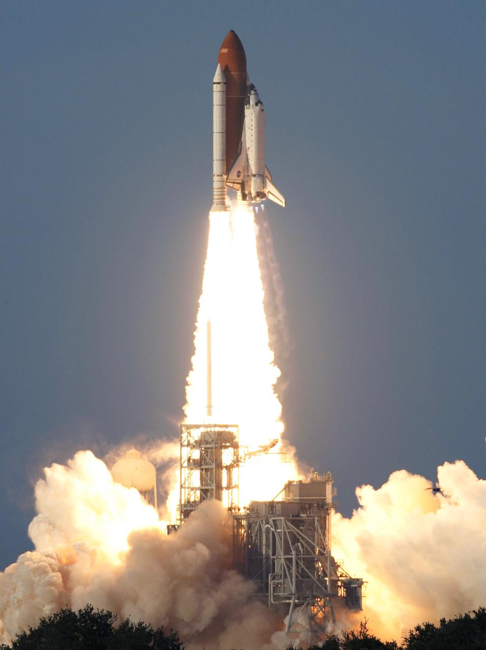 STS117-S-016 (8 June 2007) --- The Space Shuttle Atlantis and its seven-member STS-117 crew head toward Earth-orbit and a scheduled link-up with the International Space Station. Liftoff from Kennedy Space Center's launch pad 39A occurred at 7:38 p.m. (EDT) on June 8, 2007. Onboard are astronauts Rick Sturckow, commander; Lee Archambault, pilot; Jim Reilly, Patrick Forrester, John "Danny" Olivas, Steven Swanson and Clayton Anderson, all mission specialists. Anderson will join Expedition 15 in progress to serve as a flight engineer aboard the station. Atlantis will dock with the orbital outpost on Sunday, June 10, to begin a joint mission that will increase the complex's power generation capability. Using the shuttle and station robotic arms and conducting three scheduled spacewalks, the astronauts will install another set of giant solar array wings on the station and retract another array, preparing it for a future move.