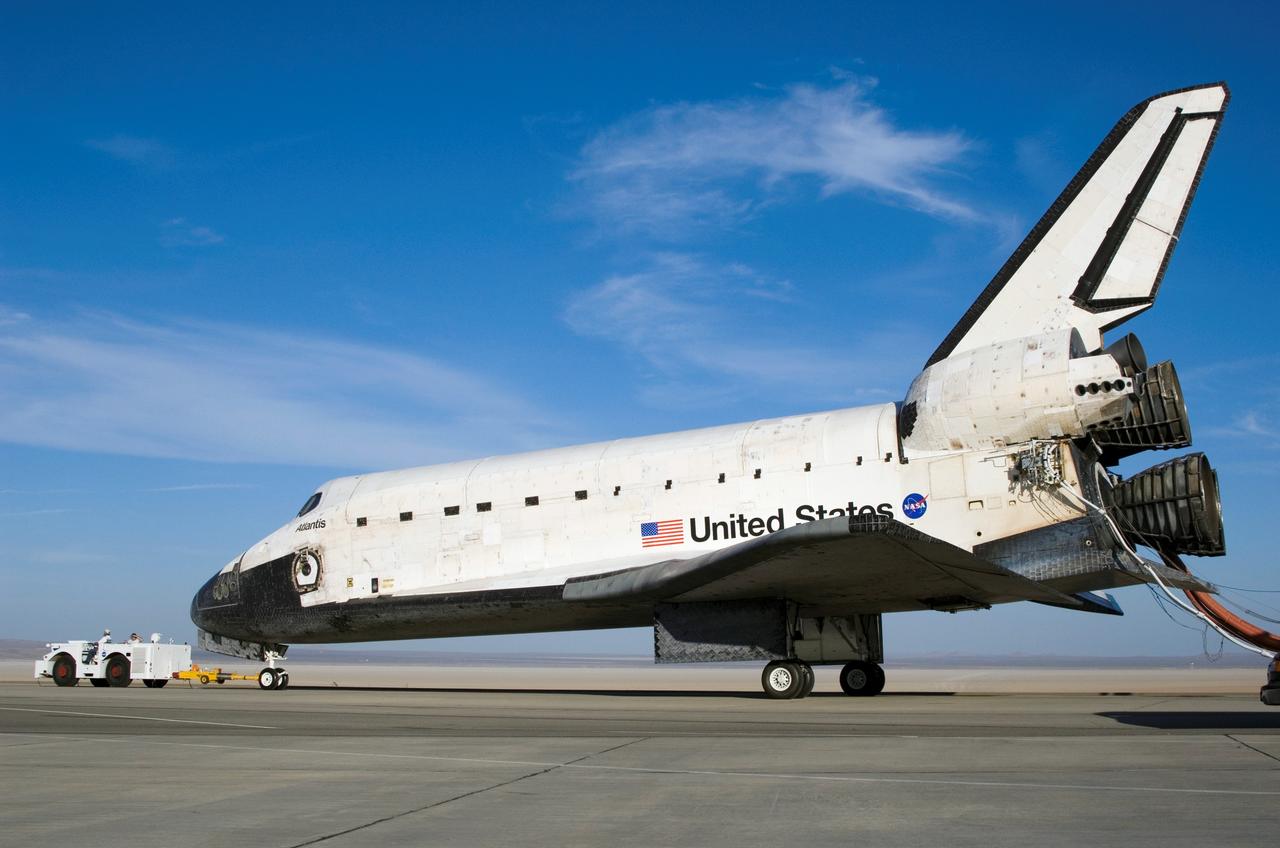 STS117-S-054 (22 June 2007) --- The Space Shuttle Atlantis is towed from the runway at Edwards Air Force Base to NASA Dryden Flight Research Center's Mate-Demate Device (MDD) for post-flight processing after a successful landing at 12:49 p.m. (PDT) on June 22, 2007.