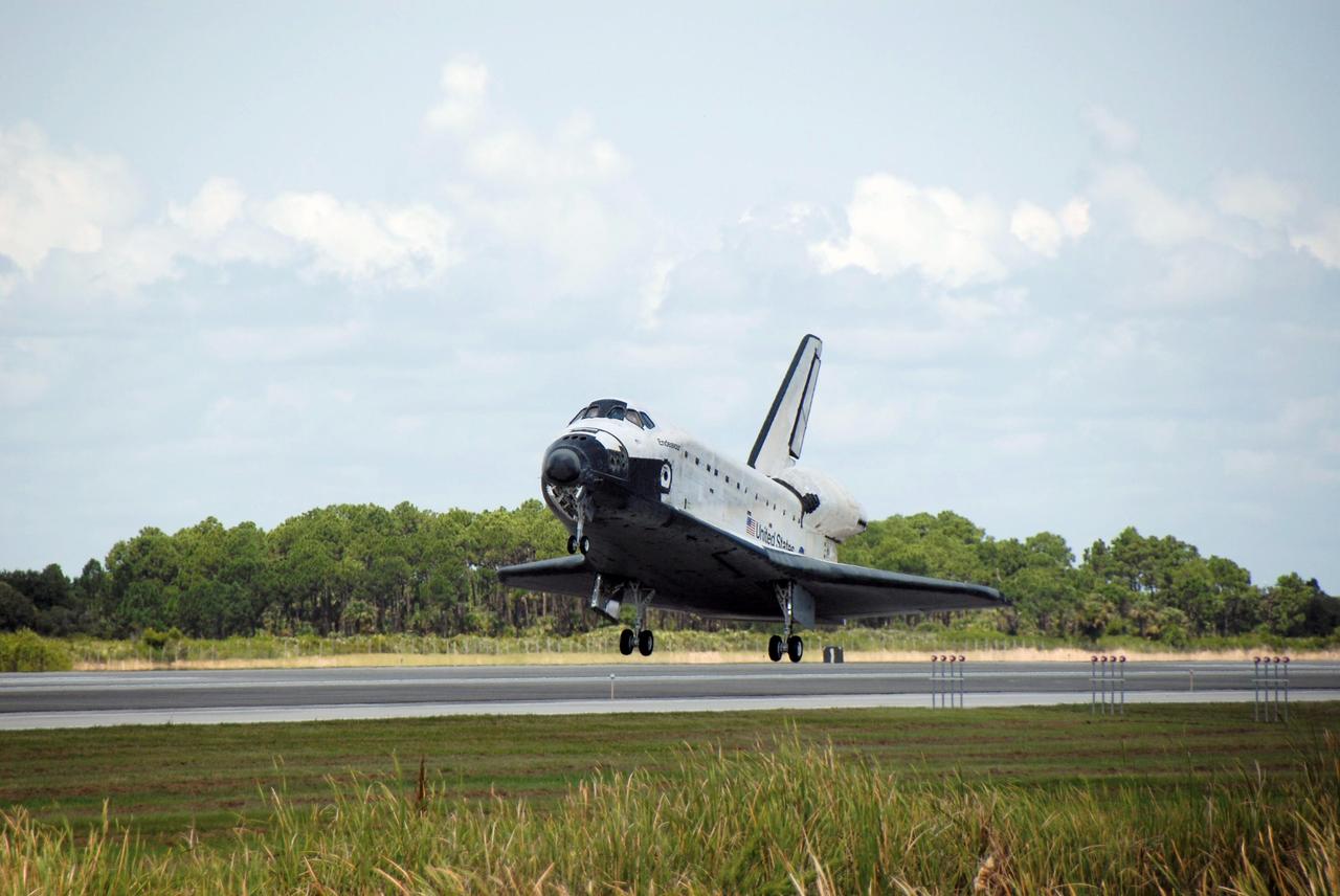 STS118-S-068 (21 Aug. 2007) --- Space Shuttle Endeavour approaches touchdown on runway 15 at NASA's Kennedy Space Center completing a 13-day mission to the International Space Station. Aboard are astronauts Scott Kelly, STS-118 commander; Charlie Hobaugh, pilot; Rick Mastracchio, Canadian Space Agency's Dave Williams, Barbara R. Morgan, Tracy Caldwell and Alvin Drew, all mission specialists. The STS-118 mission began Aug. 8 and installed a new gyroscope, an external spare parts platform and another truss segment to the expanding station. Endeavour's main gear touched down at 12:32:16 p.m. (EDT). Nose gear touchdown was at 12:32:29 p.m. and wheel stop was at 12:33:20 p.m. Endeavour traveled nearly 5.3 million miles, landing on orbit 201. STS-118 was the 119th space shuttle flight, the 22nd flight to the station, the 20th flight for Endeavour and the second of four missions planned for 2007.