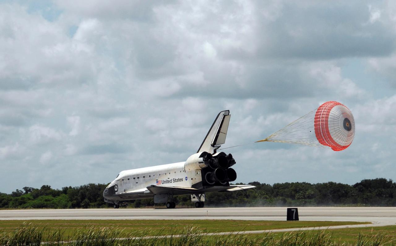 STS118-S-072 (21 Aug. 2007) --- Space Shuttle Endeavour's drag chute is fully deployed as the spacecraft rolls toward wheels stop on runway 15 at NASA's Kennedy Space Center completing a 13-day mission to the International Space Station. Aboard are astronauts Scott Kelly, STS-118 commander; Charlie Hobaugh, pilot; Rick Mastracchio, Canadian Space Agency's Dave Williams, Barbara R. Morgan, Tracy Caldwell and Alvin Drew, all mission specialists. The STS-118 mission began Aug. 8 and installed a new gyroscope, an external spare parts platform and another truss segment to the expanding station. Endeavour's main gear touched down at 12:32:16 p.m. (EDT). Nose gear touchdown was at 12:32:29 p.m. and wheel stop was at 12:33:20 p.m. Endeavour traveled nearly 5.3 million miles, landing on orbit 201. STS-118 was the 119th space shuttle flight, the 22nd flight to the station, the 20th flight for Endeavour and the second of four missions planned for 2007.