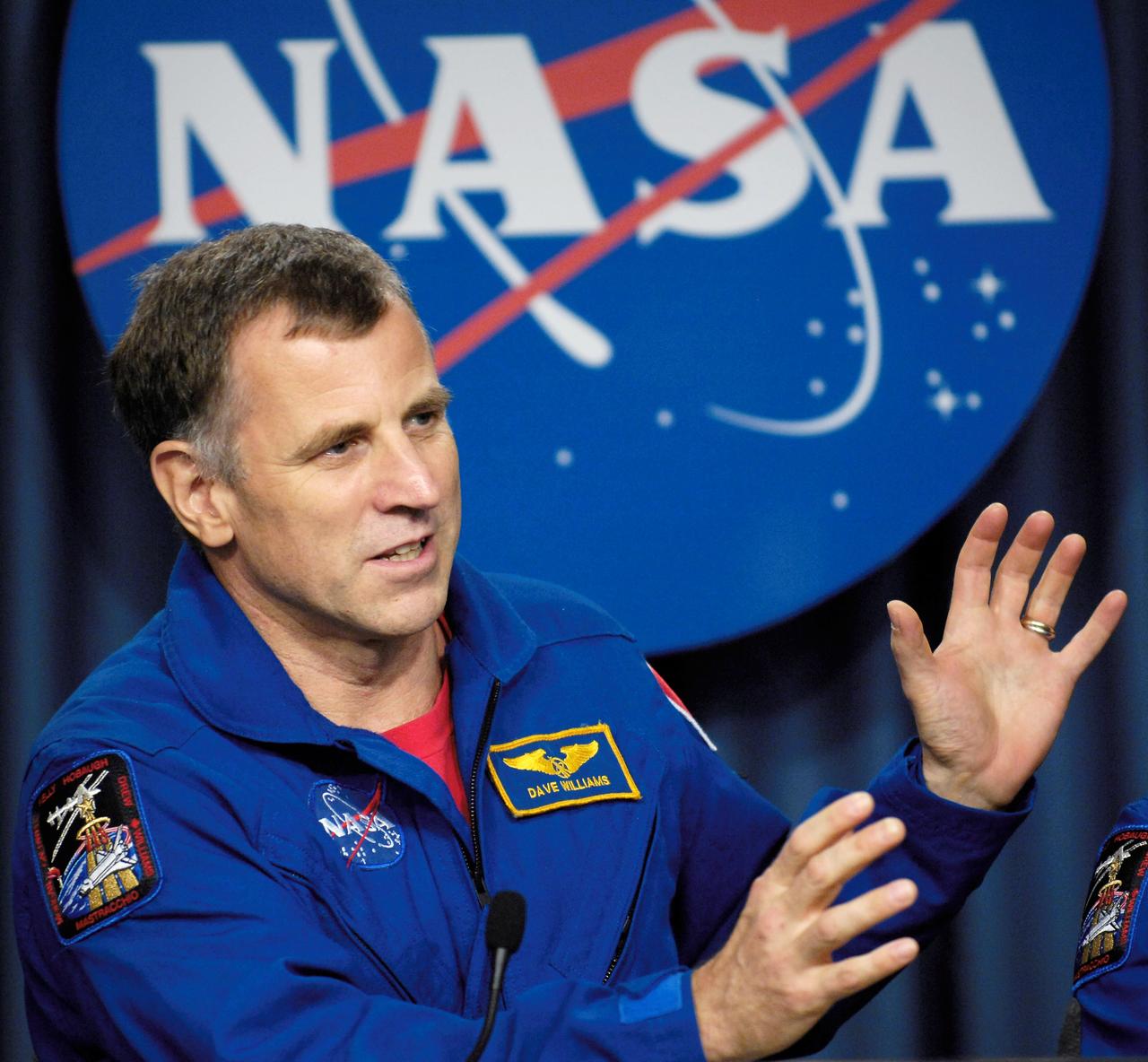 STS118-S-078 (21 Aug. 2007) --- Astronaut Dave Williams, mission specialist  representing the Canadian Space Agency, answers questions during the STS-118 post flight crew press conference. Williams and the rest of STS-118 crew members landed onboard the space shuttle Endeavour  Aug. 21, 2007, at the Kennedy Space Center, Florida.  Photo Credit: NASA/Bill Ingalls
