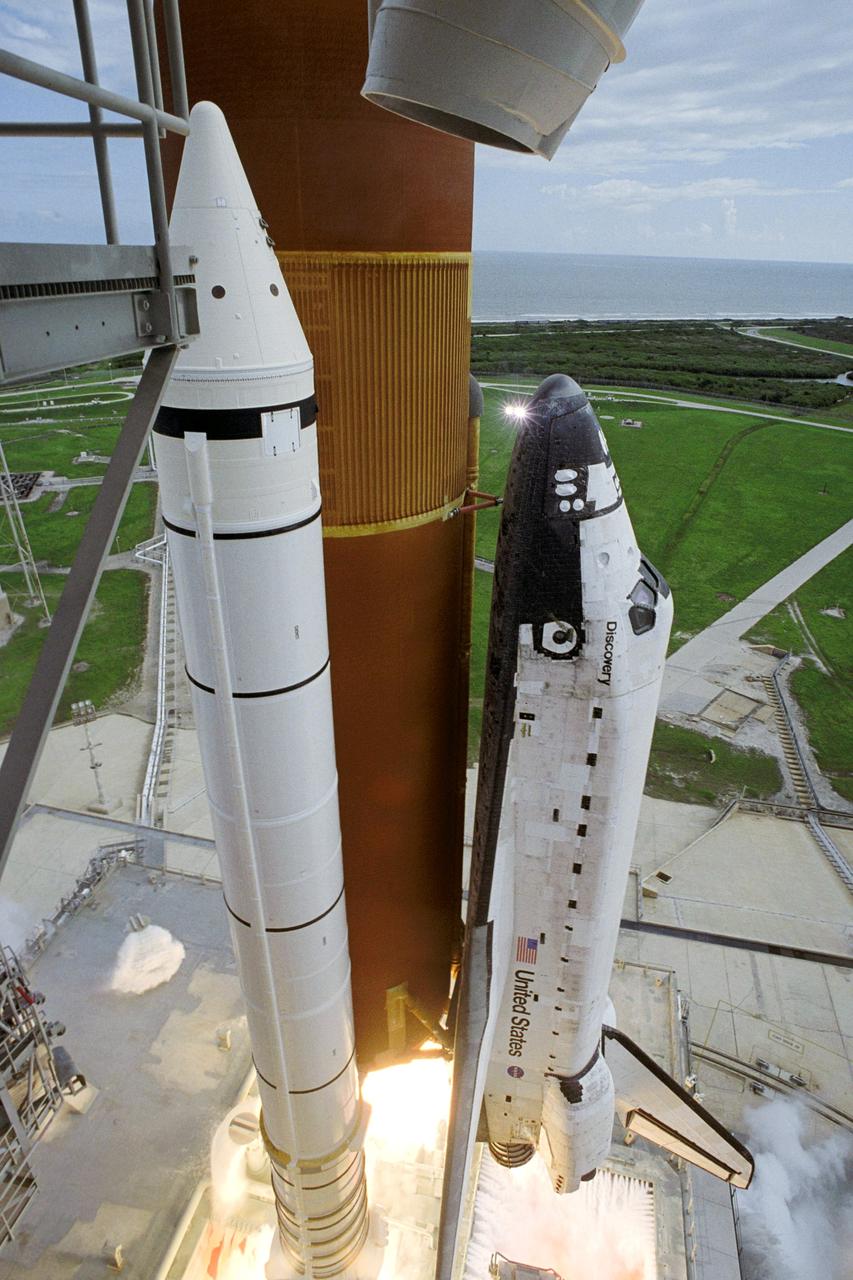 STS120-S-044 (23 Oct. 2007) --- The Space Shuttle Discovery and its seven-member STS-120 crew head toward Earth-orbit and a scheduled link-up with the International Space Station. Liftoff from Kennedy Space Center's launch pad 39A occurred at 11:38:19 a.m. (EDT). Onboard are astronauts Pam Melroy, commander; George Zamka, pilot; Scott Parazynski, Stephanie Wilson, Doug Wheelock, European Space Agency's (ESA) Paolo Nespoli and Daniel Tani, all mission specialists. Discovery will link up with the station on Thursday, Oct. 25, to begin a joint mission to continue construction by delivering the Italian-built U.S. Node 2, called Harmony. During the 14-day mission, the crew will install Harmony and move the P6 solar arrays to their permanent position and deploy them.