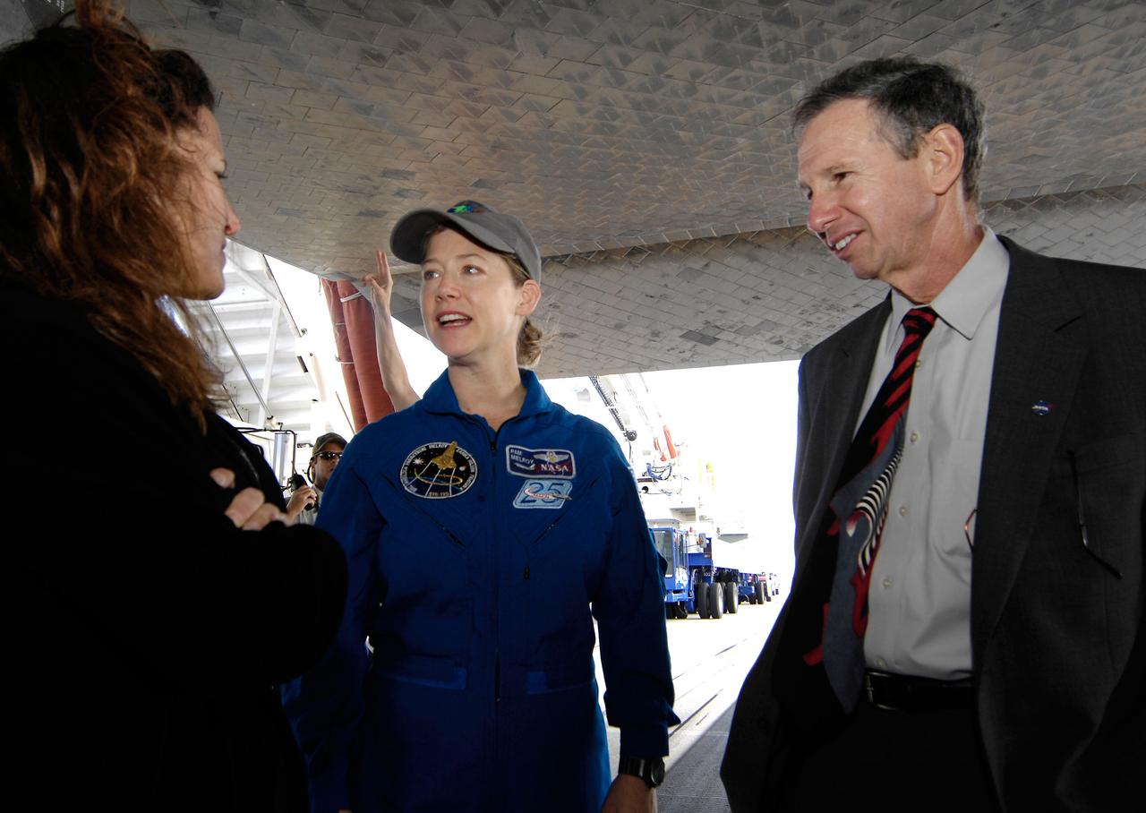 Space shuttle Discovery Commander Pam Melroy talks with NASA Administrator Michael Griffin and his wife, Rebecca Griffin, shortly after Melroy and the crew of STS-120 landed at NASA's Kennedy Space Center in Florida. Discovery landed at 1:02pm EST Wednesday after a mission that included on-orbit construction of the station with the installation of the Harmony Node 2 module and the relocation of the P6 truss. Photo Credit: 'NASA/Bill Ingalls"