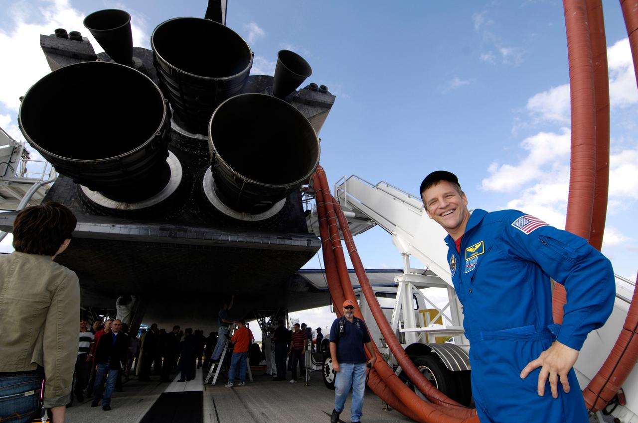 Astronaut Scott Parazynski smiles for a photo while he and the crew of STS-120 walk around and look at the underside of the space shuttle Discovery shortly after their 1:01pm EST landing at NASA's Kennedy Space Center in Florida. Parazynski performed a repair of a damaged solar array during one of his spacewalks at the International Space Station. Photo Credit: "NASA/Bill Ingalls"