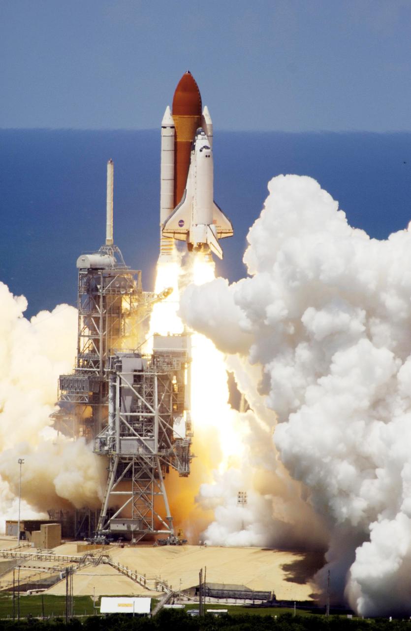 STS121-S-023 (4 July 2006) --- Space Shuttle Discovery and its seven-member crew launched at 2:38 p.m. (EDT) to begin the two-day journey to the International Space Station on the historic Return to Flight STS-121 mission. Discovery is slated to dock with the station at 10:52 a.m. (EDT) Thursday July 6, 2006. The shuttle made history as it was the first human-occupying spacecraft to launch on Independence Day. During the 12-day mission, the STS-121 crew of seven will test new equipment and procedures to improve shuttle safety, as well as deliver supplies and make repairs to the space station.