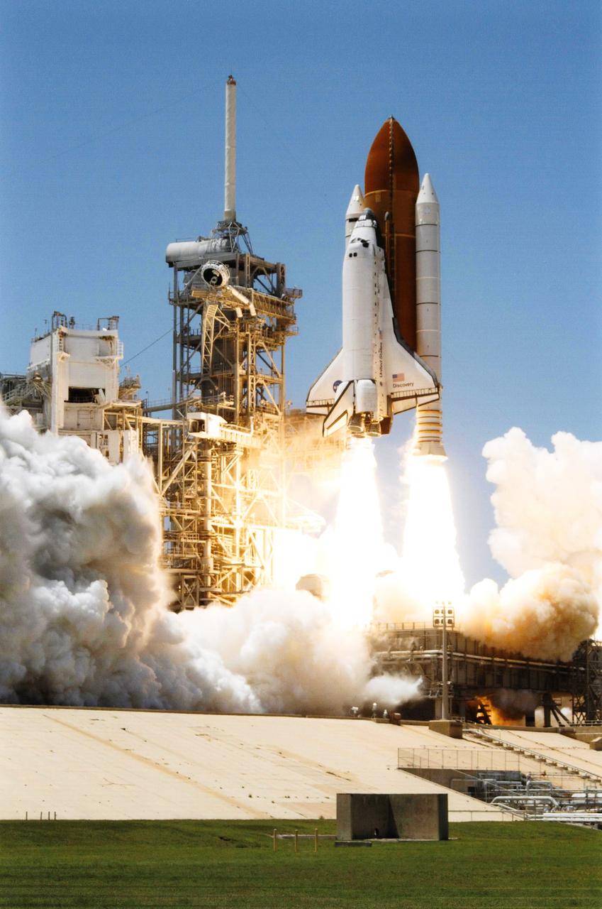 STS121-S-026 (4 July 2006) --- Space Shuttle Discovery and its seven-member crew launched at 2:38 p.m. (EDT) to begin the two-day journey to the International Space Station on the historic Return to Flight STS-121 mission. Discovery is slated to dock with the station at 10:52 a.m. (EDT) Thursday July 6, 2006. The shuttle made history as it was the first human-occupying spacecraft to launch on Independence Day. During the 12-day mission, the STS-121 crew of seven will test new equipment and procedures to improve shuttle safety, as well as deliver supplies and make repairs to the space station.