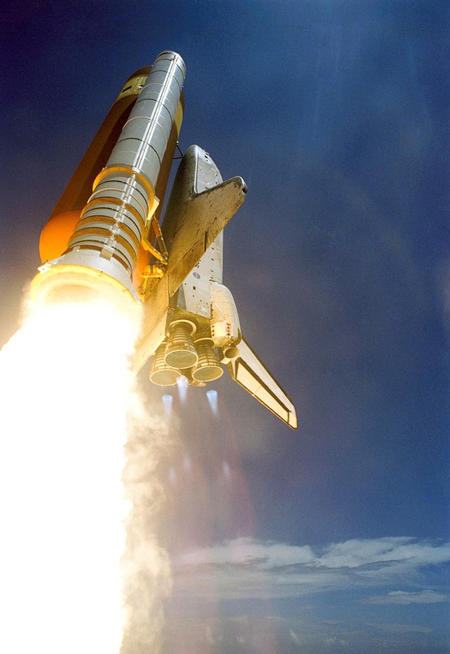 STS121-S-029 (4 July 2006) --- Space Shuttle Discovery and its seven-member crew launched at 2:38 p.m. (EDT) to begin the two-day journey to the International Space Station on the historic Return to Flight STS-121 mission. Discovery is slated to dock with the station at 10:52 a.m. (EDT) Thursday July 6, 2006. The shuttle made history as it was the first human-occupying spacecraft to launch on Independence Day. During the 12-day mission, the STS-121 crew of seven will test new equipment and procedures to improve shuttle safety, as well as deliver supplies and make repairs to the space station.