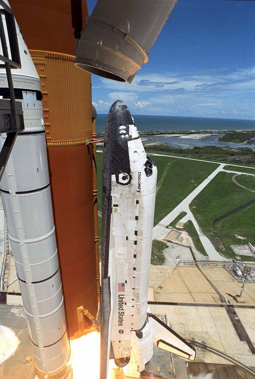 STS121-S-031 (4 July 2006) --- Space Shuttle Discovery and its seven-member crew launched at 2:38 p.m. (EDT) to begin the two-day journey to the International Space Station on the historic Return to Flight STS-121 mission. Discovery is slated to dock with the station at 10:52 a.m. (EDT) Thursday July 6, 2006. The shuttle made history as it was the first human-occupying spacecraft to launch on Independence Day. During the 12-day mission, the STS-121 crew of seven will test new equipment and procedures to improve shuttle safety, as well as deliver supplies and make repairs to the space station.