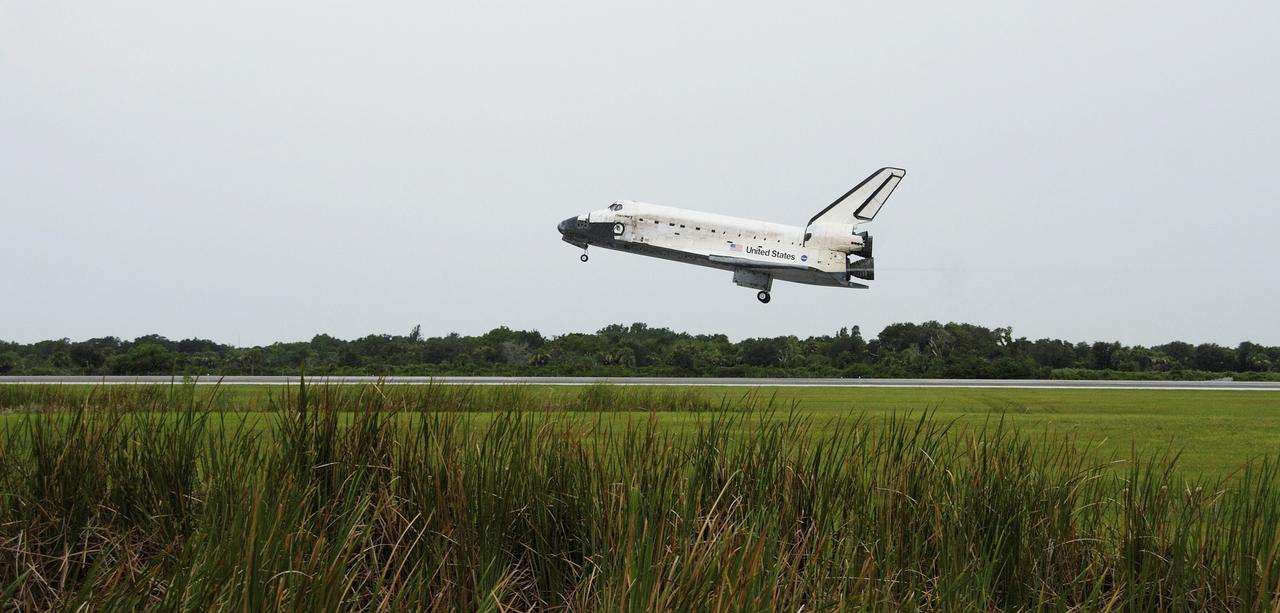 STS121-S-052 (17 July 2006) --- Space Shuttle Discovery, with commander Steven W. Lindsey at the helm, approaches runway 15 at Kennedy Space Center's Shuttle Landing Facility at 9:14 a.m. (EDT) on July 17, 2006. Also onboard were astronauts Mark E. Kelly, pilot; Piers J. Sellers, Michael E. Fossum, Lisa M. Nowak and Stephanie D. Wilson, all mission specialists. During the nearly 13-day mission, the STS-121 crew tested new equipment and procedures to improve shuttle safety, and delivered supplies and made repairs to the International Space Station.