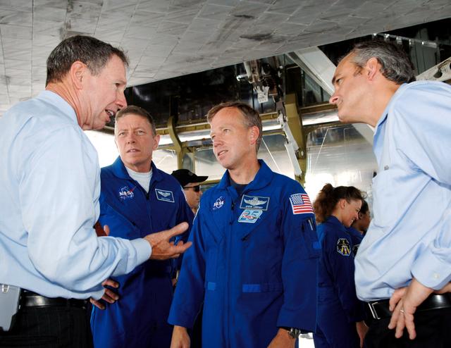 NASA image: Griffen and Geveden talk with STS-121 crewmembers after landing