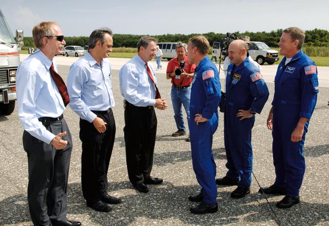NASA image: Gerstenmaier, Griffen, Geveden talk with STS-121 crewmembers after landing