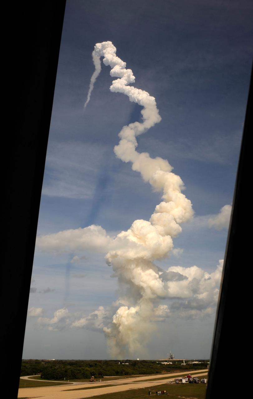 The launch of the Space Shuttle Atlantis (STS-122) as seen through the louvered windows of the Launch Control Center Thursday, Feb. 7, 2008, at the Kennedy Space Center in Cape Canaveral, Fla. The Shuttle lifted off from launch pad 39A at 2:45p.m. EST. Photo Credit: (NASA/Bill Ingalls)