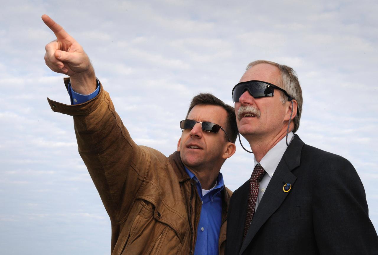 NASA Manager for Launch Integration, Leroy Cain, left, and NASA Associate Administrator for Space Operations, William H. Gerstenmaier watch as the The space shuttle Atlantis (STS-122) lands at the Shuttle Landing Facility, 9:07a.m., Wednesday, Feb. 20, 2008 at Kennedy Space Center, Fla. completing delivery of the European Space Agency’s (ESA) Columbus laboratory to the International Space Station. Photo Credit: (NASA/Bill Ingalls)
