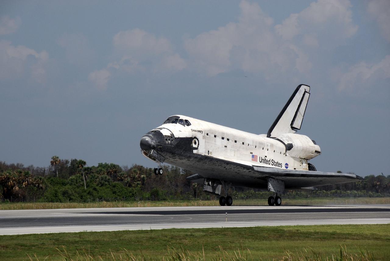 STS124-S-048 (14 June 2008) --- Space Shuttle Discovery touches down on runway 15 of the Shuttle Landing Facility at NASA's Kennedy Space Center, concluding the 14-day STS-124 mission to the International Space Station. Onboard are NASA astronauts Mark Kelly, commander; Ken Ham, pilot; Mike Fossum, Ron Garan, Karen Nyberg, Garrett Reisman and Japan Aerospace Exploration Agency astronaut Akihiko Hoshide, all mission specialists. The main landing gear touched down at 11:15:19 a.m. (EDT) on June 14, 2008. The nose landing gear touched down at 11:15:30 a.m. and wheel stop was at 11:16:19 a.m. During the mission, Discovery's crew installed the Japan Aerospace Exploration Agency's large Kibo laboratory and its remote manipulator system leaving a larger space station and one with increased science capabilities.