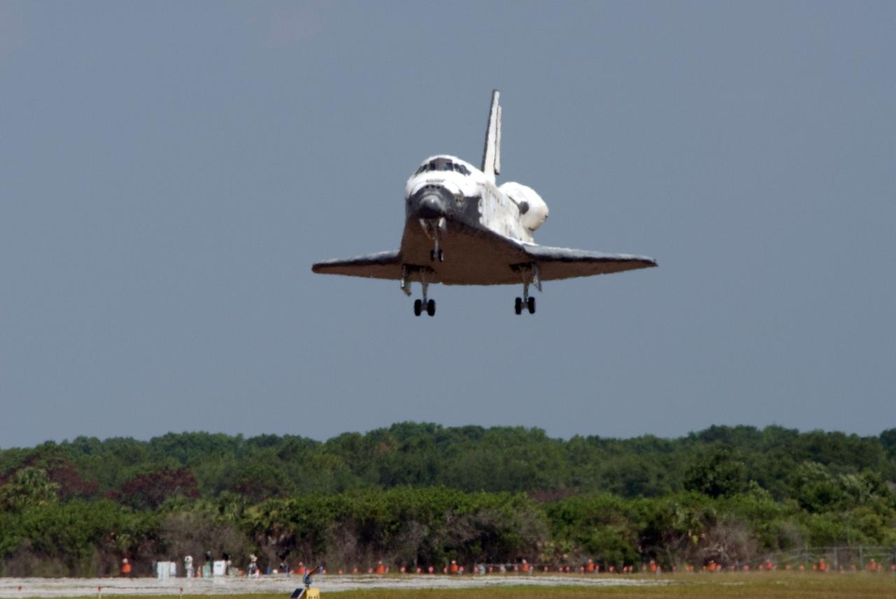 STS124-S-057 (14 June 2008) --- Space Shuttle Discovery is moments away from touchdown on runway 15 of the Shuttle Landing Facility at NASA's Kennedy Space Center, concluding the 14-day STS-124 mission to the International Space Station. Onboard are NASA astronauts Mark Kelly, commander; Ken Ham, pilot; Mike Fossum, Ron Garan, Karen Nyberg, Garrett Reisman and Japan Aerospace Exploration Agency astronaut Akihiko Hoshide, all mission specialists. The main landing gear touched down at 11:15:19 a.m. (EDT) on June 14, 2008. The nose landing gear touched down at 11:15:30 a.m. and wheel stop was at 11:16:19 a.m. During the mission, Discovery's crew installed the Japan Aerospace Exploration Agency's large Kibo laboratory and its remote manipulator system leaving a larger space station and one with increased science capabilities.