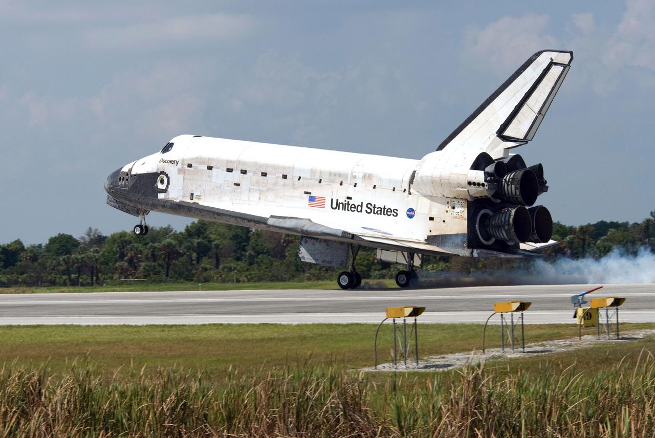 STS124-S-058 (14 June 2008) --- Space Shuttle Discovery touches down on runway 15 of the Shuttle Landing Facility at NASA's Kennedy Space Center, concluding the 14-day STS-124 mission to the International Space Station. Onboard are NASA astronauts Mark Kelly, commander; Ken Ham, pilot; Mike Fossum, Ron Garan, Karen Nyberg, Garrett Reisman and Japan Aerospace Exploration Agency astronaut Akihiko Hoshide, all mission specialists. The main landing gear touched down at 11:15:19 a.m. (EDT) on June 14, 2008. The nose landing gear touched down at 11:15:30 a.m. and wheel stop was at 11:16:19 a.m. During the mission, Discovery's crew installed the Japan Aerospace Exploration Agency's large Kibo laboratory and its remote manipulator system leaving a larger space station and one with increased science capabilities.