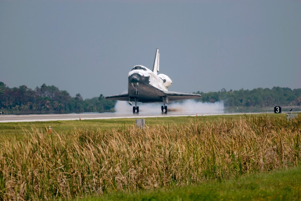 STS124-S-060 (14 June 2008) --- Space Shuttle Discovery touches down on runway 15 of the Shuttle Landing Facility at NASA's Kennedy Space Center, concluding the 14-day STS-124 mission to the International Space Station. Onboard are NASA astronauts Mark Kelly, commander; Ken Ham, pilot; Mike Fossum, Ron Garan, Karen Nyberg, Garrett Reisman and Japan Aerospace Exploration Agency astronaut Akihiko Hoshide, all mission specialists. The main landing gear touched down at 11:15:19 a.m. (EDT) on June 14, 2008. The nose landing gear touched down at 11:15:30 a.m. and wheel stop was at 11:16:19 a.m. During the mission, Discovery's crew installed the Japan Aerospace Exploration Agency's large Kibo laboratory and its remote manipulator system leaving a larger space station and one with increased science capabilities.