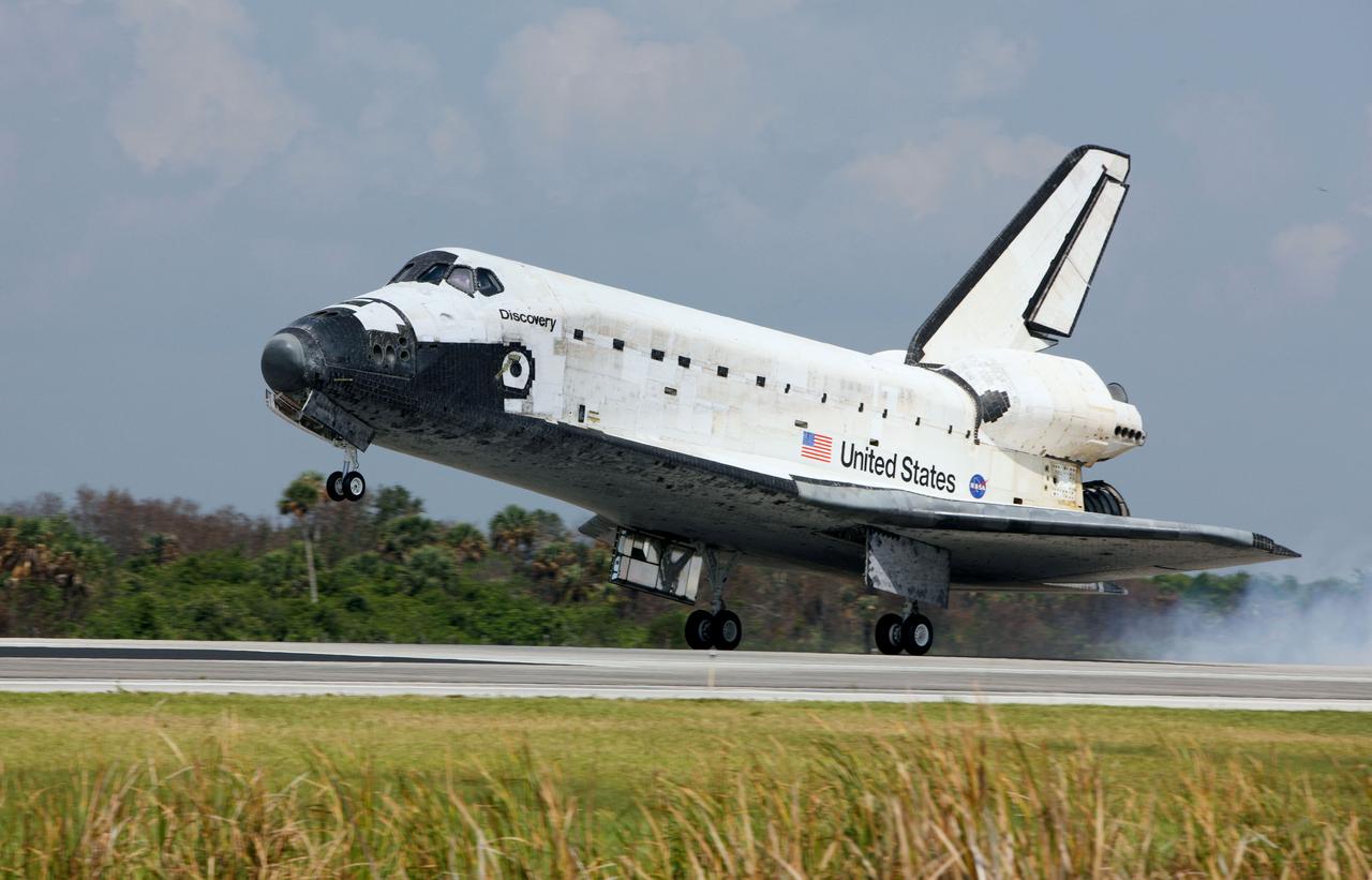 STS124-S-062 (14 June 2008) --- Space Shuttle Discovery touches down on runway 15 of the Shuttle Landing Facility at NASA's Kennedy Space Center, concluding the 14-day STS-124 mission to the International Space Station. Onboard are NASA astronauts Mark Kelly, commander; Ken Ham, pilot; Mike Fossum, Ron Garan, Karen Nyberg, Garrett Reisman and Japan Aerospace Exploration Agency astronaut Akihiko Hoshide, all mission specialists. The main landing gear touched down at 11:15:19 a.m. (EDT) on June 14, 2008. The nose landing gear touched down at 11:15:30 a.m. and wheel stop was at 11:16:19 a.m. During the mission, Discovery's crew installed the Japan Aerospace Exploration Agency's large Kibo laboratory and its remote manipulator system leaving a larger space station and one with increased science capabilities.