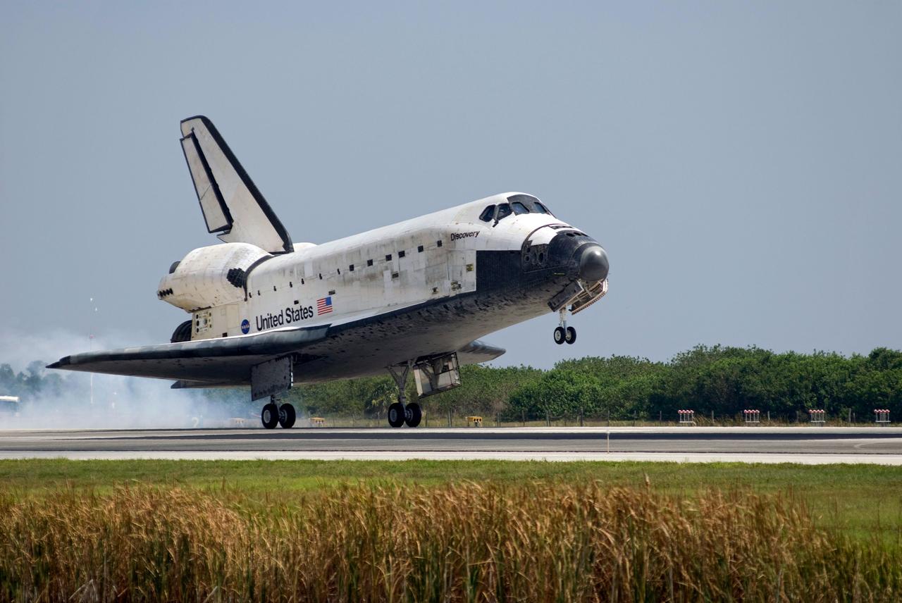 STS124-S-066 (14 June 2008) --- Space Shuttle Discovery touches down on runway 15 of the Shuttle Landing Facility at NASA's Kennedy Space Center, concluding the 14-day STS-124 mission to the International Space Station. Onboard are NASA astronauts Mark Kelly, commander; Ken Ham, pilot; Mike Fossum, Ron Garan, Karen Nyberg, Garrett Reisman and Japan Aerospace Exploration Agency astronaut Akihiko Hoshide, all mission specialists. The main landing gear touched down at 11:15:19 a.m. (EDT) on June 14, 2008. The nose landing gear touched down at 11:15:30 a.m. and wheel stop was at 11:16:19 a.m. During the mission, Discovery's crew installed the Japan Aerospace Exploration Agency's large Kibo laboratory and its remote manipulator system leaving a larger space station and one with increased science capabilities.