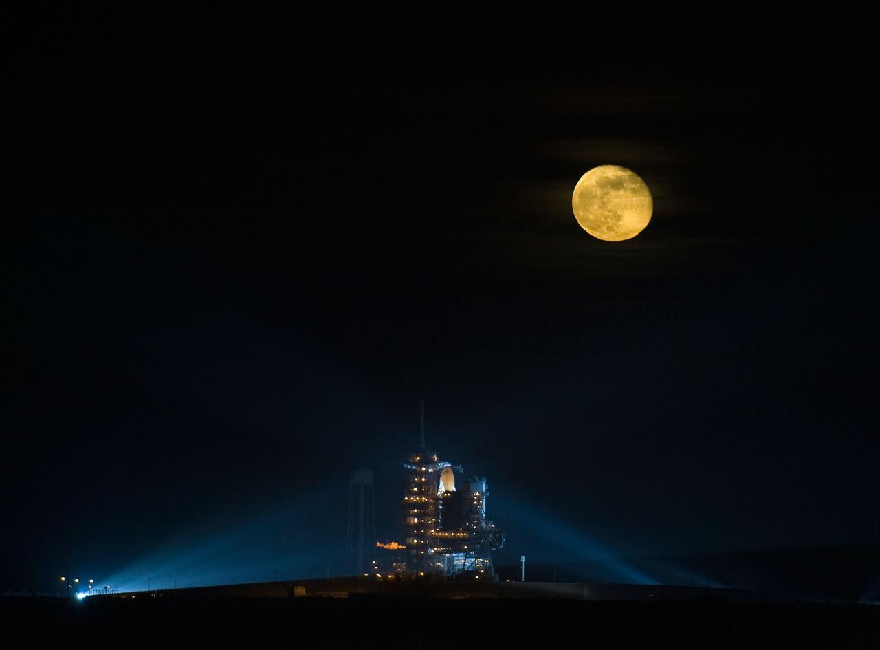 The Moon is seen rising behind the Space Shuttle Endeavour (STS-126) on pad 39a Friday, November 14, 2008, at the Kennedy Space Center in Cape Canaveral, Fla. The Shuttle lifted off from launch pad 39A at 7:55 p.m. EST. Photo Credit: (NASA/Bill Ingalls)