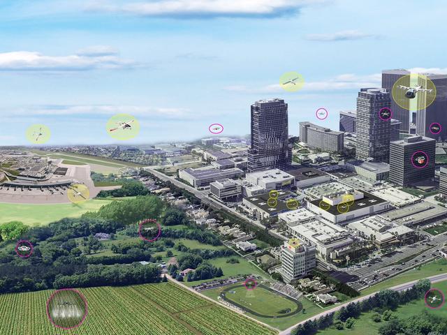 The concept of urban air mobility involves multiple aircraft safely operating within a city. (Yellow circles are vehicles with passengers; pink circles are vehicles without passengers.)