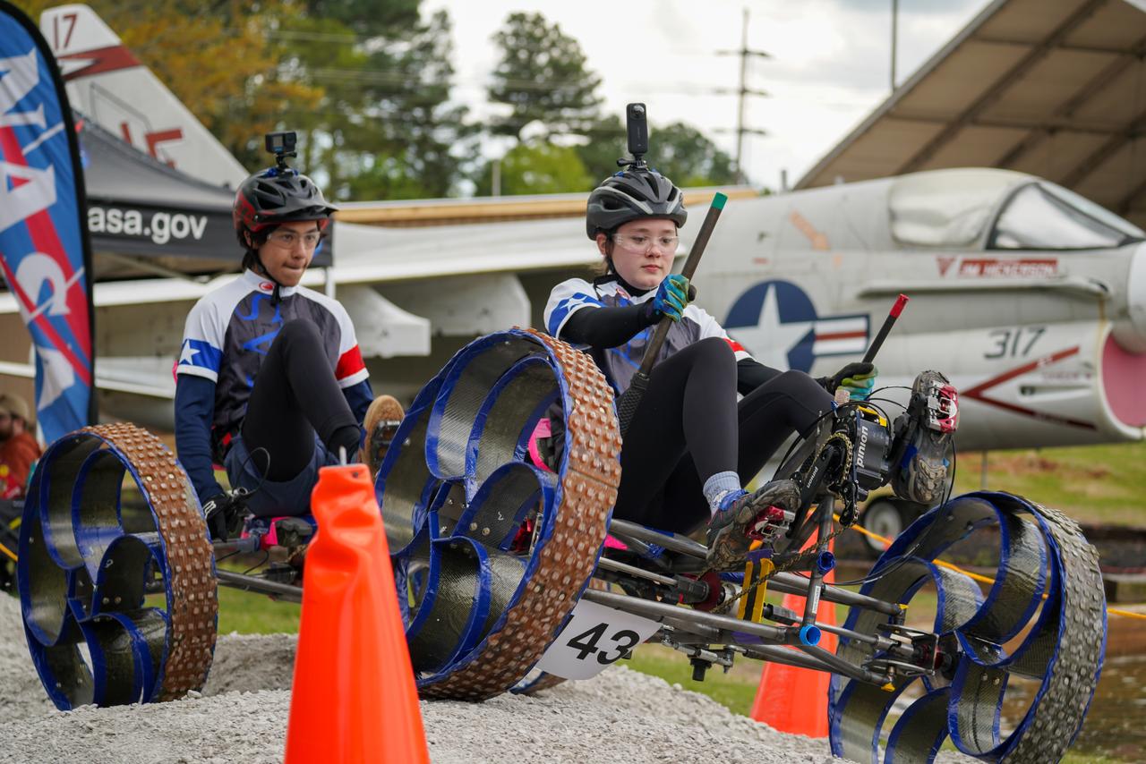 More than 500 students with 75 teams from around the world participated in the 31st year of NASA’s Human Exploration Rover Challenge (HERC) on April 11 and April 12, 2025, near NASA’s Marshall Space Flight Center in Huntsville, Alabama. Participating teams represented 35 colleges and universities, 38 high schools, and two middle schools from 20 states, Puerto Rico, and 16 other nations. NASA expanded the 2025 challenge to include a remote-control division - named Remote-Operated Vehicular Research - and invited middle school students to participate. Teams were awarded points based on navigating a half-mile obstacle course, conducting mission-specific task challenges, and completing multiple safety and design reviews with NASA engineers.