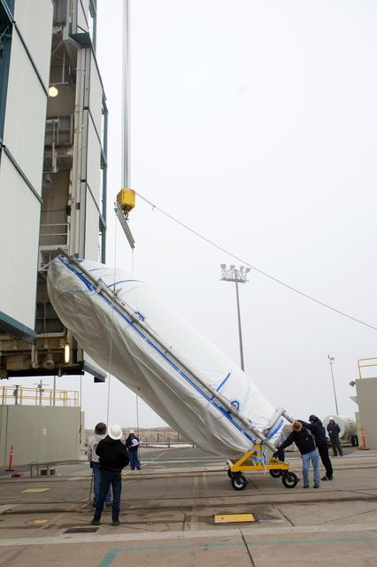 NASA image: Delta II JPSS-1 Fairing Bi-Sector Halves Hoisted to MST
