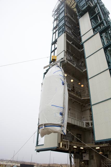 NASA image: Delta II JPSS-1 Fairing Bi-Sector Halves Hoisted to MST