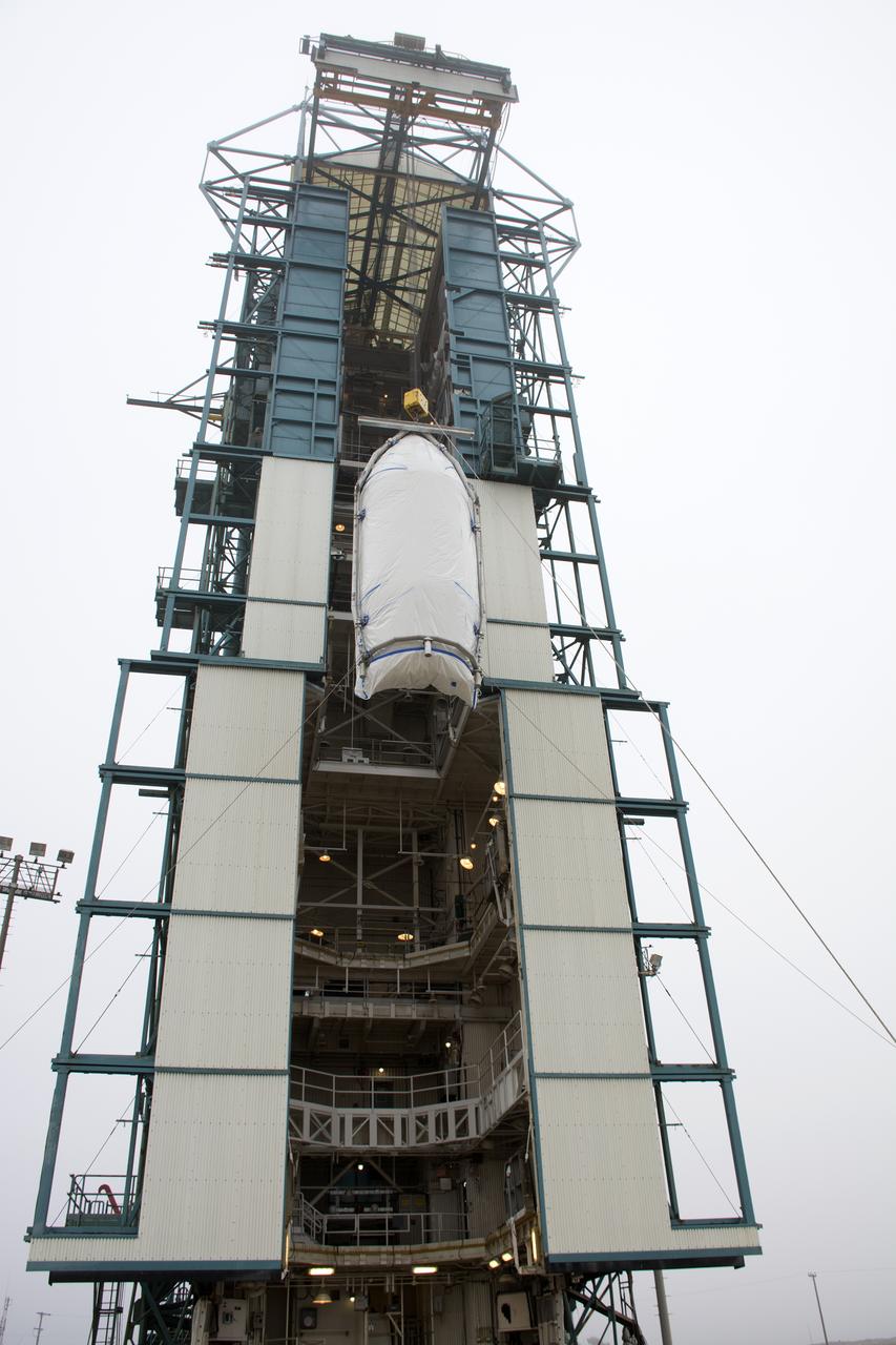 A bi-sector half of the payload fairing for a United Launch Alliance Delta II rocket is lifted toward level 4 of the mobile service tower on Space Launch Complex 2 at Vandenberg Air Force Base in California. Preparations are underway for launch of the Joint Polar Satellite System (JPSS-1) spacecraft in 2017. JPSS-1 is part of the next-generation environmental satellite system, a collaborative program between the National Oceanic and Atmospheric Administration (NOAA) and NASA. To learn more about JPSS-1, visit http://www.jpss.noaa.gov.