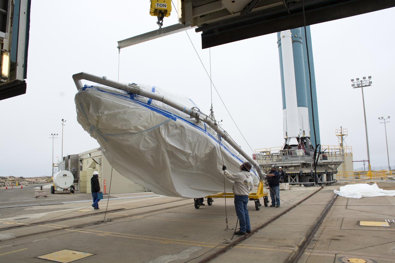 A bi-sector half of the payload fairing for a United Launch Alliance Delta II rocket is lifted upright for its move into the mobile service tower on Space Launch Complex 2 at Vandenberg Air Force Base in California. Preparations are underway for launch of the Joint Polar Satellite System (JPSS-1) spacecraft in 2017. JPSS-1 is part of the next-generation environmental satellite system, a collaborative program between the National Oceanic and Atmospheric Administration (NOAA) and NASA. To learn more about JPSS-1, visit http://www.jpss.noaa.gov.