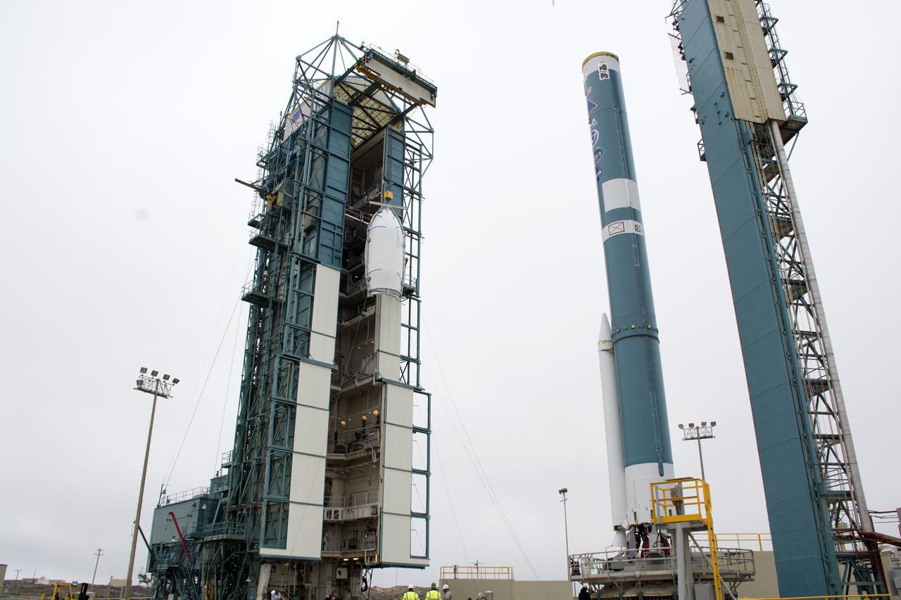 A bi-sector half of the payload fairing for a United Launch Alliance Delta II rocket is lifted toward level 4 of the mobile service tower on Space Launch Complex 2 at Vandenberg Air Force Base in California. Preparations are underway for launch of the Joint Polar Satellite System (JPSS-1) spacecraft in 2017. JPSS-1 is part of the next-generation environmental satellite system, a collaborative program between the National Oceanic and Atmospheric Administration (NOAA) and NASA. To learn more about JPSS-1, visit http://www.jpss.noaa.gov.