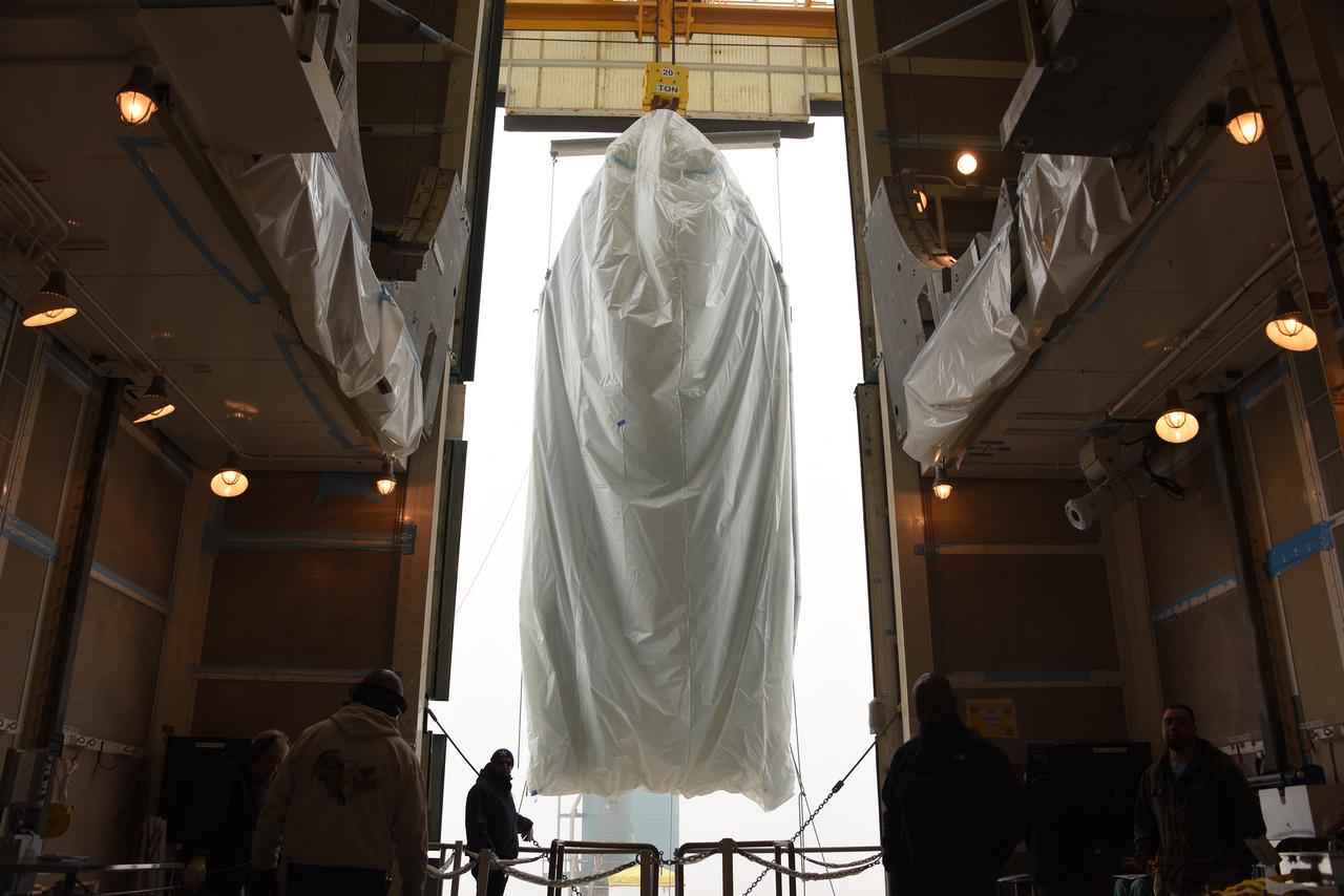 A bi-sector half of the payload fairing for a United Launch Alliance Delta II rocket glides into the clean room on level 4 of the mobile service tower on Space Launch Complex 2 at Vandenberg Air Force Base in California. Preparations are underway for launch of the Joint Polar Satellite System (JPSS-1) spacecraft in 2017. JPSS-1 is part of the next-generation environmental satellite system, a collaborative program between the National Oceanic and Atmospheric Administration (NOAA) and NASA. To learn more about JPSS-1, visit http://www.jpss.noaa.gov.