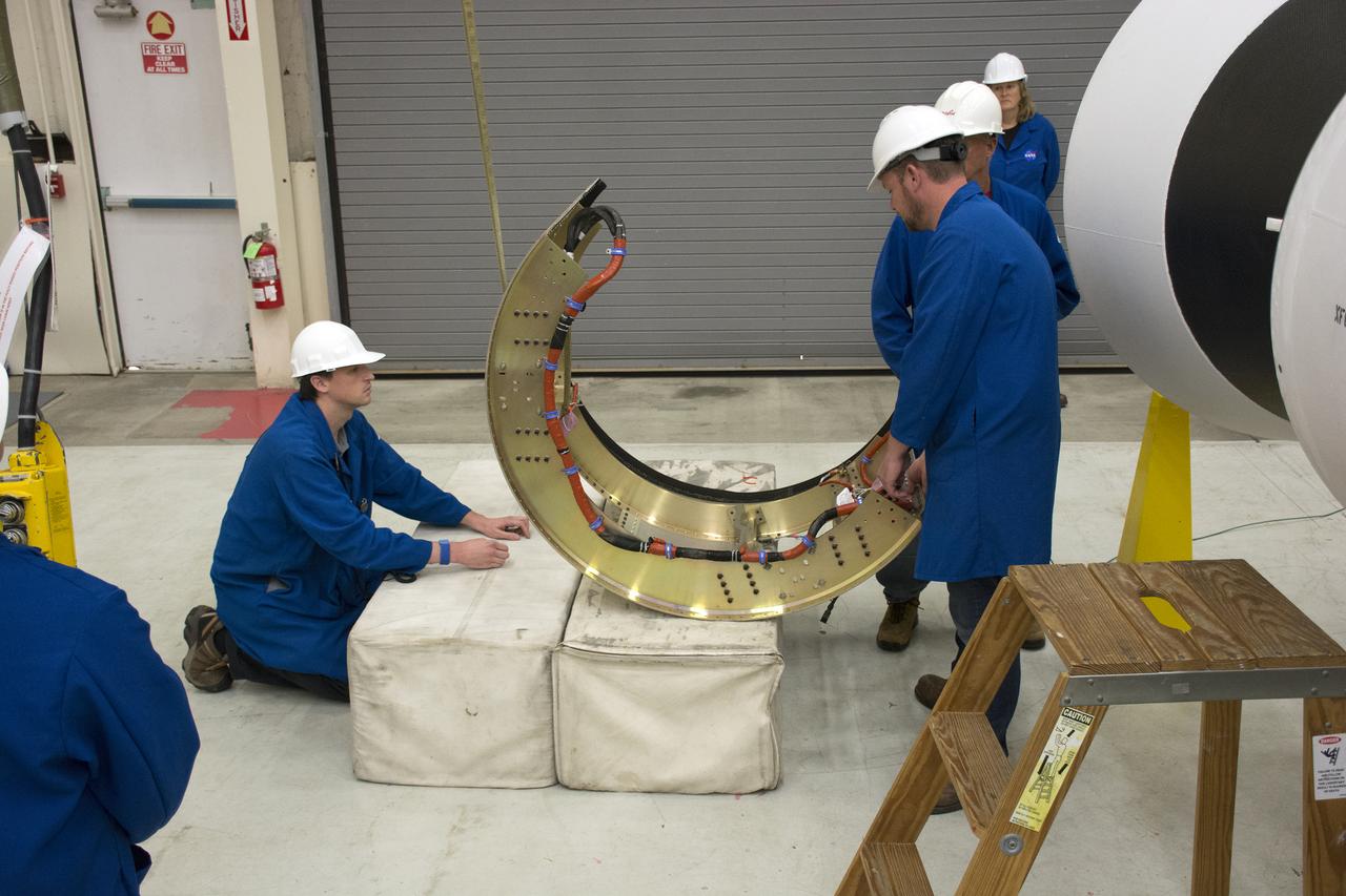 Inside Building 1555 at Vandenberg Air Force Base in California, technicians and engineers install the first stage aft skirt on the Orbital ATK Pegasus XL rocket which will launch eight NASA Cyclone Global Navigation Satellite System, or CYGNSS, spacecraft. When preparations are completed at Vandenberg, the rocket, with CYGNSS in its payload fairing, will be attached to the Orbital ATK L-1011 carrier aircraft and transported to NASA’s Kennedy Space Center in Florida. On Dec. 12, 2016, the carrier aircraft is scheduled to take off from the Skid Strip at Cape Canaveral Air Force Station and CYGNSS will launch on the Pegasus XL rocket with the L-1011 flying off shore. CYGNSS will make frequent and accurate measurements of ocean surface winds throughout the life cycle of tropical storms and hurricanes. The data that CYGNSS provides will enable scientists to probe key air-sea interaction processes that take place near the core of storms, which are rapidly changing and play a critical role in the beginning and intensification of hurricanes.