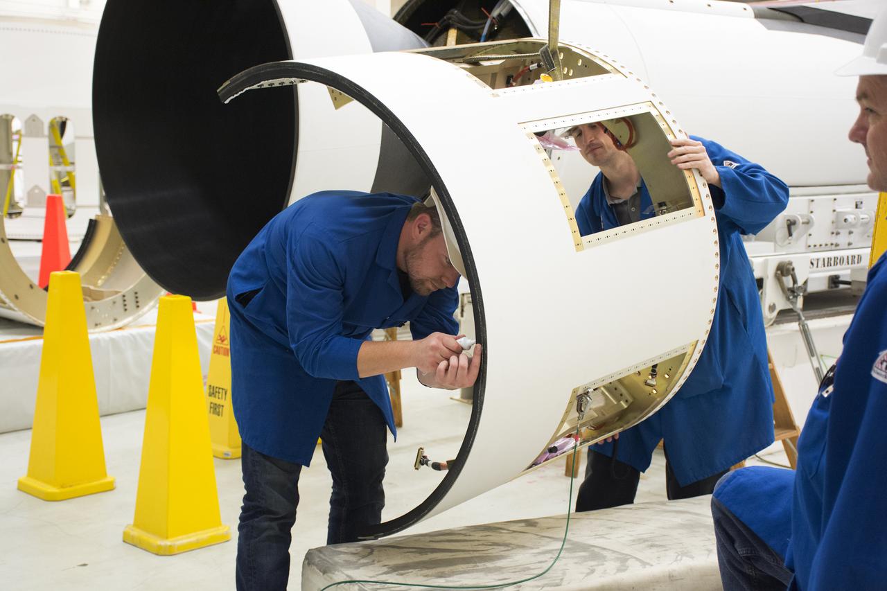 Inside Building 1555 at Vandenberg Air Force Base in California, technicians and engineers install the first stage aft skirt on the Orbital ATK Pegasus XL rocket which will launch eight NASA Cyclone Global Navigation Satellite System, or CYGNSS, spacecraft. When preparations are completed at Vandenberg, the rocket, with CYGNSS in its payload fairing, will be attached to the Orbital ATK L-1011 carrier aircraft and transported to NASA’s Kennedy Space Center in Florida. On Dec. 12, 2016, the carrier aircraft is scheduled to take off from the Skid Strip at Cape Canaveral Air Force Station and CYGNSS will launch on the Pegasus XL rocket with the L-1011 flying off shore. CYGNSS will make frequent and accurate measurements of ocean surface winds throughout the life cycle of tropical storms and hurricanes. The data that CYGNSS provides will enable scientists to probe key air-sea interaction processes that take place near the core of storms, which are rapidly changing and play a critical role in the beginning and intensification of hurricanes.