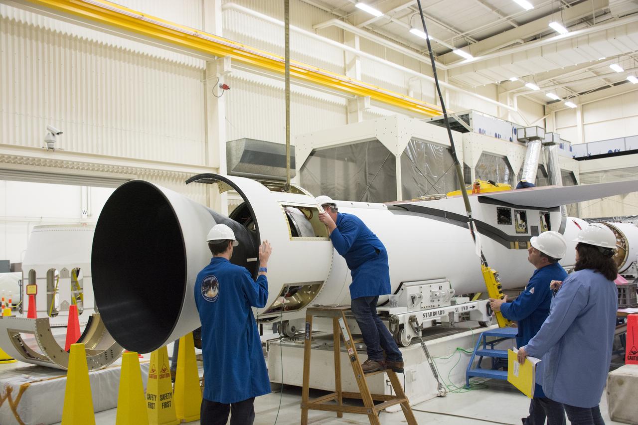Inside Building 1555 at Vandenberg Air Force Base in California, technicians and engineers install the first stage aft skirt on the Orbital ATK Pegasus XL rocket which will launch eight NASA Cyclone Global Navigation Satellite System, or CYGNSS, spacecraft. When preparations are completed at Vandenberg, the rocket, with CYGNSS in its payload fairing, will be attached to the Orbital ATK L-1011 carrier aircraft and transported to NASA’s Kennedy Space Center in Florida. On Dec. 12, 2016, the carrier aircraft is scheduled to take off from the Skid Strip at Cape Canaveral Air Force Station and CYGNSS will launch on the Pegasus XL rocket with the L-1011 flying off shore. CYGNSS will make frequent and accurate measurements of ocean surface winds throughout the life cycle of tropical storms and hurricanes. The data that CYGNSS provides will enable scientists to probe key air-sea interaction processes that take place near the core of storms, which are rapidly changing and play a critical role in the beginning and intensification of hurricanes.
