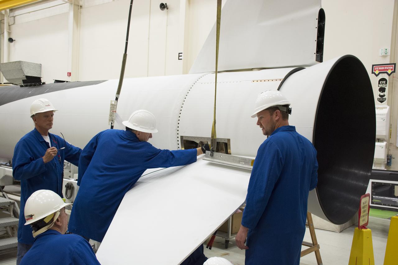 Technicians prepare to install one of the fins on the Orbital ATK Pegasus XL rocket inside Building 1555 at Vandenberg Air Force Base in California. The fins will provide aerodynamic stability during flight. The rocket is being prepared at Vandenberg, and then will be transported to NASA’s Kennedy Space Center in Florida attached to the Orbital ATK L-1011 carrier aircraft with NASA’s Cyclone Global Navigation Satellite System (CYGNSS) in its payload fairing. CYGNSS will launch on the Pegasus XL rocket from the Skid Strip at Cape Canaveral Air Force Station. CYGNSS will make frequent and accurate measurements of ocean surface winds throughout the life cycle of tropical storms and hurricanes. The data that CYGNSS provides will enable scientists to probe key air-sea interaction processes that take place near the core of storms, which are rapidly changing and play a critical role in the beginning and intensification of hurricanes. 