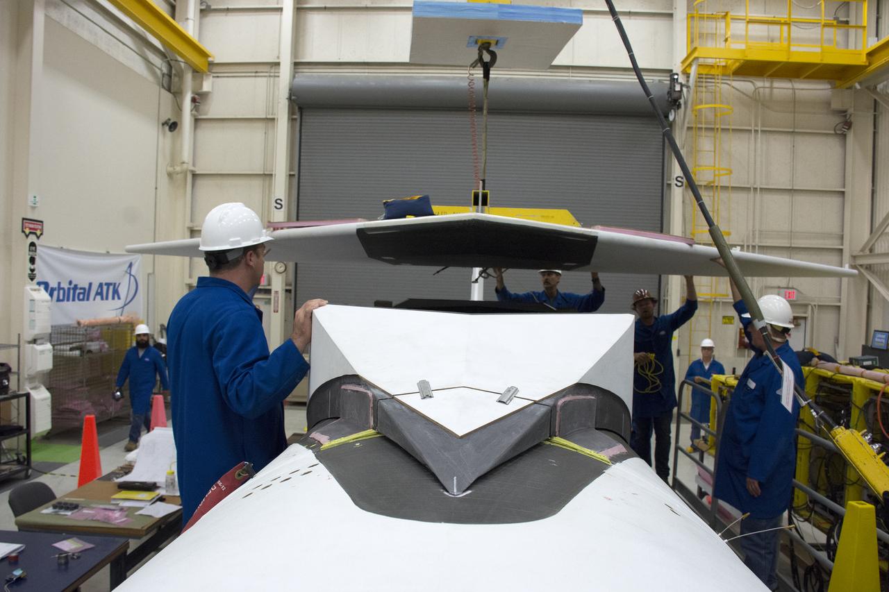 Inside Building 1555 at Vandenberg Air Force Base in California, technicians and engineers perform final wing installations on the Orbital ATK Pegasus XL rocket which will launch eight NASA Cyclone Global Navigation Satellite System, or CYGNSS, spacecraft. When preparations are completed at Vandenberg, the rocket, with CYGNSS in its payload fairing, will be attached to the Orbital ATK L-1011 carrier aircraft and transported to NASA’s Kennedy Space Center in Florida. On Dec. 12, 2016, the carrier aircraft is scheduled to take off from the Skid Strip at Cape Canaveral Air Force Station and CYGNSS will launch on the Pegasus XL rocket with the L-1011 flying off shore. CYGNSS will make frequent and accurate measurements of ocean surface winds throughout the life cycle of tropical storms and hurricanes. The data that CYGNSS provides will enable scientists to probe key air-sea interaction processes that take place near the core of storms, which are rapidly changing and play a critical role in the beginning and intensification of hurricanes.