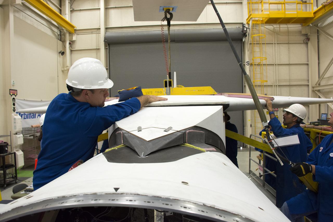 Inside Building 1555 at Vandenberg Air Force Base in California, technicians and engineers perform final wing installations on the Orbital ATK Pegasus XL rocket which will launch eight NASA Cyclone Global Navigation Satellite System, or CYGNSS, spacecraft. When preparations are completed at Vandenberg, the rocket, with CYGNSS in its payload fairing, will be attached to the Orbital ATK L-1011 carrier aircraft and transported to NASA’s Kennedy Space Center in Florida. On Dec. 12, 2016, the carrier aircraft is scheduled to take off from the Skid Strip at Cape Canaveral Air Force Station and CYGNSS will launch on the Pegasus XL rocket with the L-1011 flying off shore. CYGNSS will make frequent and accurate measurements of ocean surface winds throughout the life cycle of tropical storms and hurricanes. The data that CYGNSS provides will enable scientists to probe key air-sea interaction processes that take place near the core of storms, which are rapidly changing and play a critical role in the beginning and intensification of hurricanes.