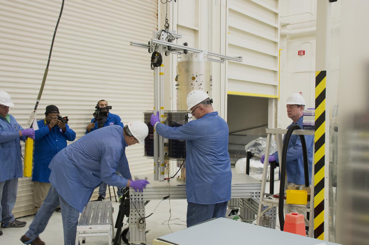 Inside Building 1555 at Vandenberg Air Force Base in California, technicians and engineers install one of eight NASA Cyclone Global Navigation Satellite System (CYGNSS) spacecraft on its deployment module. Processing activities will prepare the spacecraft for launch aboard an Orbital ATK Pegasus XL rocket. When preparations are competed at Vandenberg, the rocket will be transported to NASA’s Kennedy Space Center in Florida attached to the Orbital ATK L-1011 carrier aircraft with in its payload fairing. CYGNSS will launch on the Pegasus XL rocket from the Skid Strip at Cape Canaveral Air Force Station. CYGNSS will make frequent and accurate measurements of ocean surface winds throughout the life cycle of tropical storms and hurricanes. The data that CYGNSS provides will enable scientists to probe key air-sea interaction processes that take place near the core of storms, which are rapidly changing and play a critical role in the beginning and intensification of hurricanes.